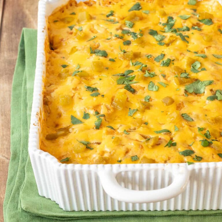View of Layered Chicken Enchilada Casserole showing cilantro garnish on top